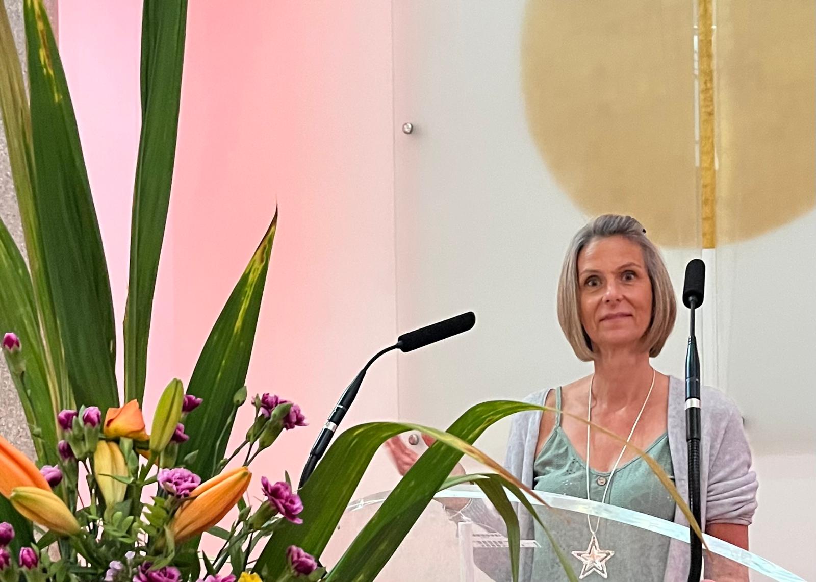 Mandy presenting at a ceremony